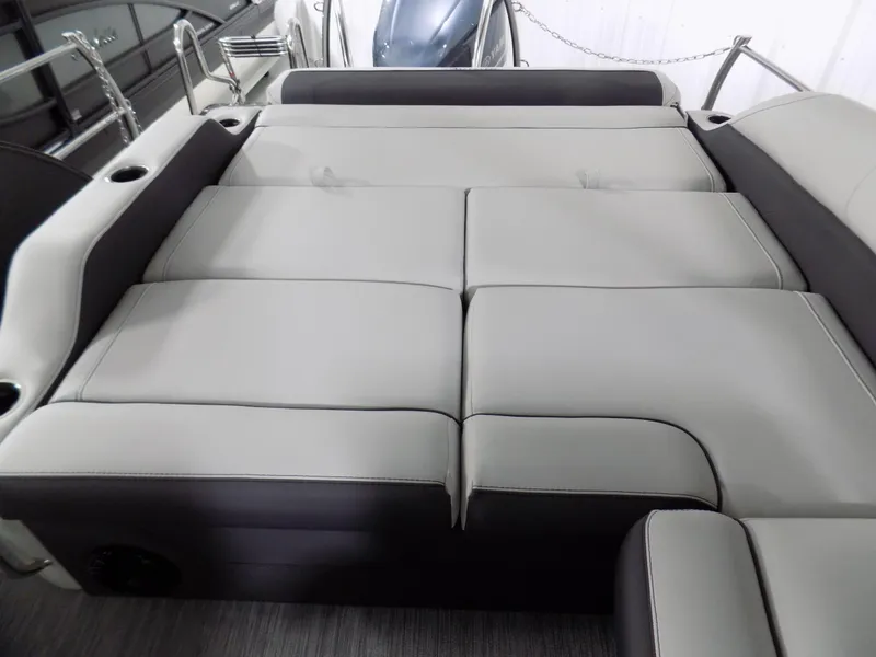 Slide: The Image of 2023 Barletta Corsa 23U boat interior with spacious, cushioned seating area. - 14