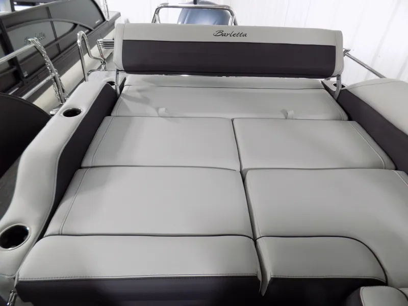 Slide: The Image of 2023 Barletta Corsa 23U boat interior with spacious, cushioned seating and cup holders. - 15