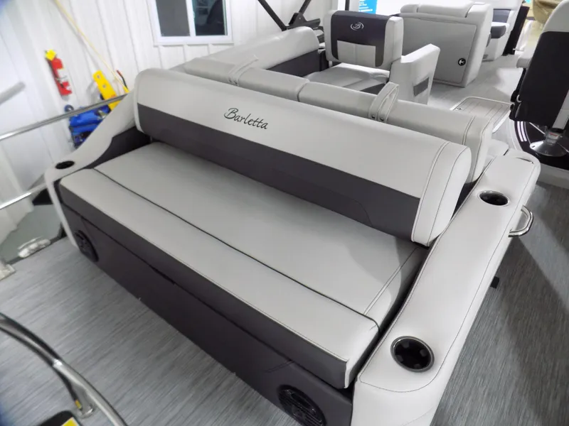 Slide: The Image of 2023 Barletta Corsa 23U boat interior with plush seating and cup holders. - 17