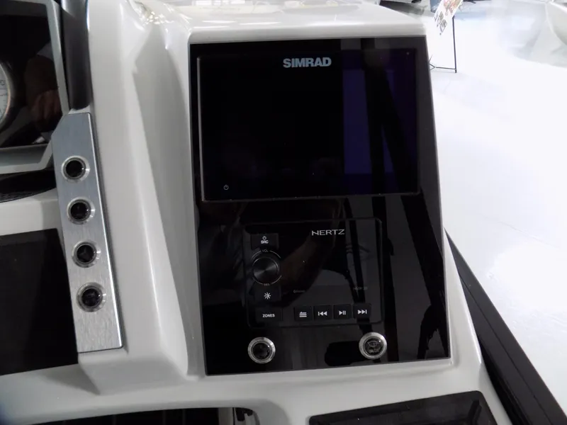 Slide: The Image of 2023 Barletta Corsa 23U dashboard featuring Simrad and Hertz controls. - 19