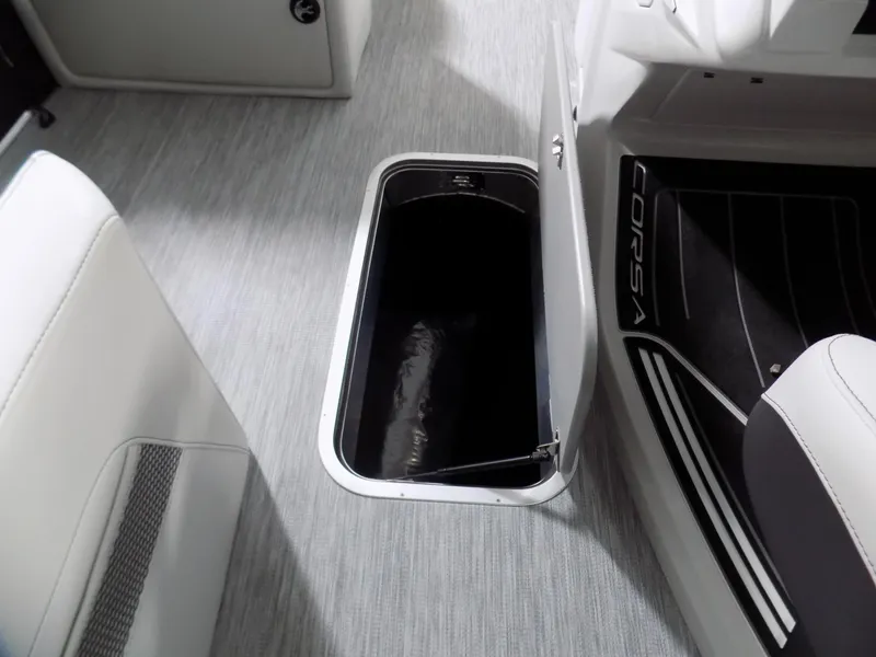 Slide: The Image of 2023 Barletta Corsa 23U boat interior with open storage compartment on sleek flooring. - 21