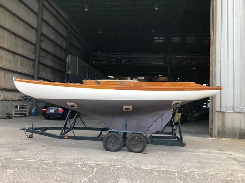 Slide: The Image of 1919 Herreshoff S Class sailboat on a trailer in a warehouse. - 1