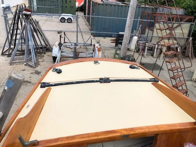 Slide: The Image of Top view of a 1919 Herreshoff S Class boat in a storage yard. - 9