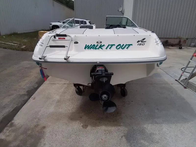 Slide: The Image of 1993 Sea Ray 180 BR boat with "Walk It Out" text on the stern. - 5