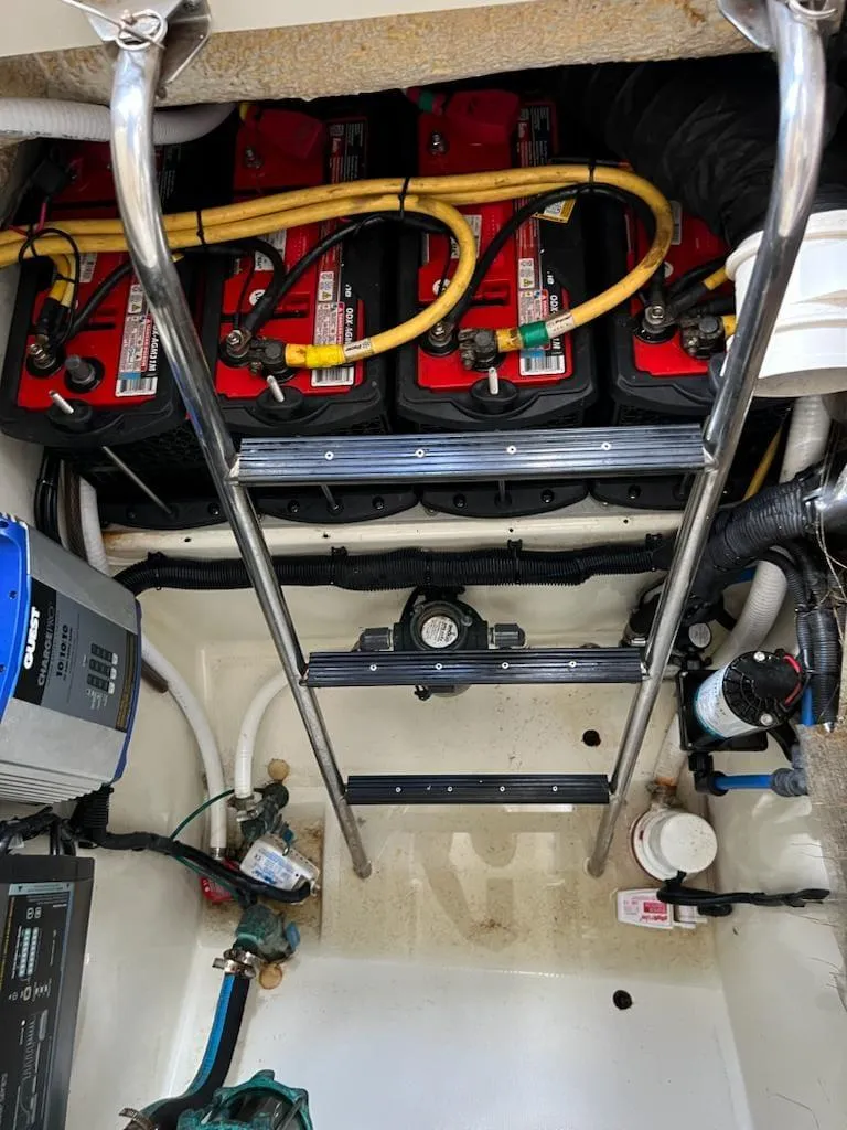 Slide: The Image of 2005 Hydra-Sports 3300 VX engine compartment with batteries and wiring. - 12