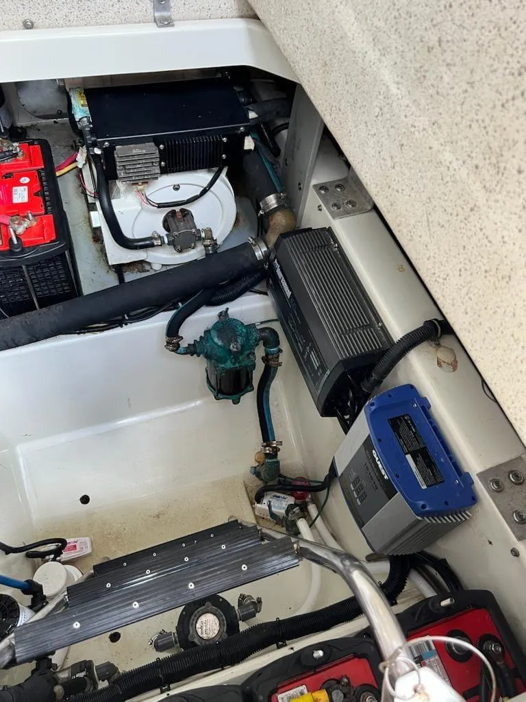 Slide: The Image of 2005 Hydra-Sports 3300 VX engine compartment with batteries and electrical components. - 13