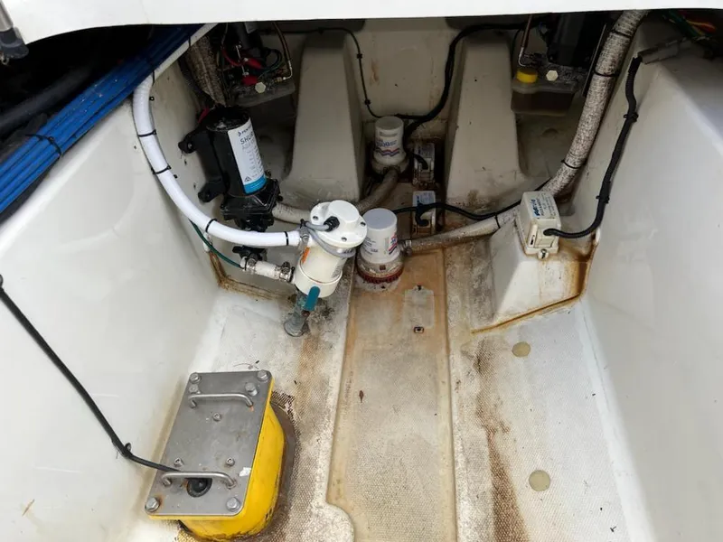 Slide: The Image of 2005 Hydra-Sports 3300 VX engine compartment with fuel filters and wiring. - 17