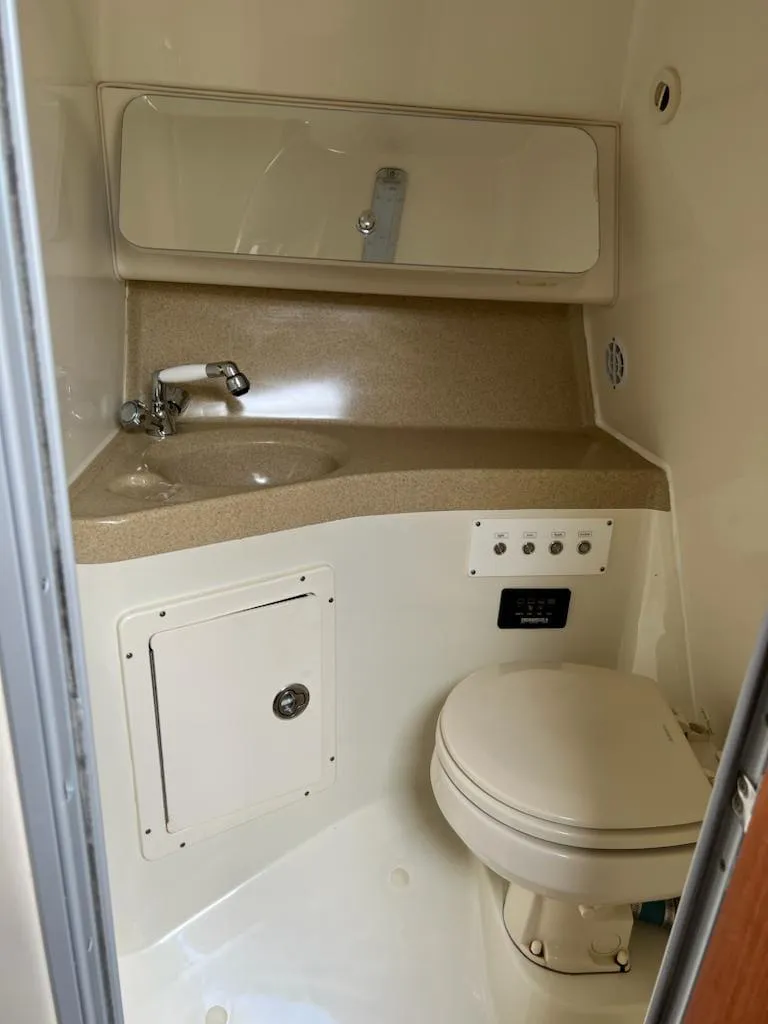 Slide: The Image of 2005 Hydra-Sports 3300 VX boat bathroom with sink and toilet. - 20