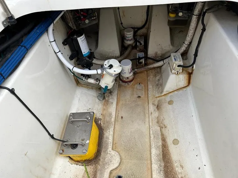 Slide: The Image of 2005 Hydra-Sports 3300 VX boat engine compartment with various components and wiring. - 21