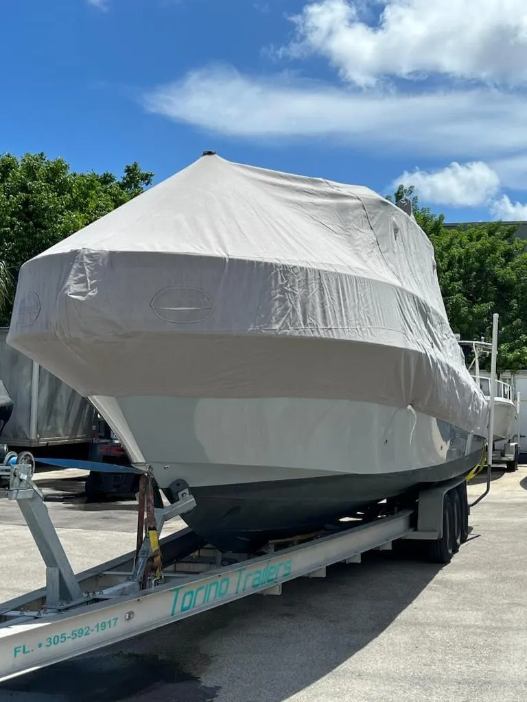 Slide: The Image of 2005 Hydra-Sports 3300 VX boat covered on a trailer. - 5