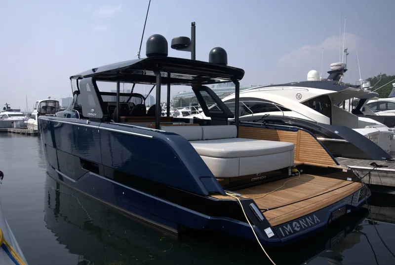 The Image of 2024 Cranchi A46 yacht docked at marina, featuring sleek design and spacious deck. - 0