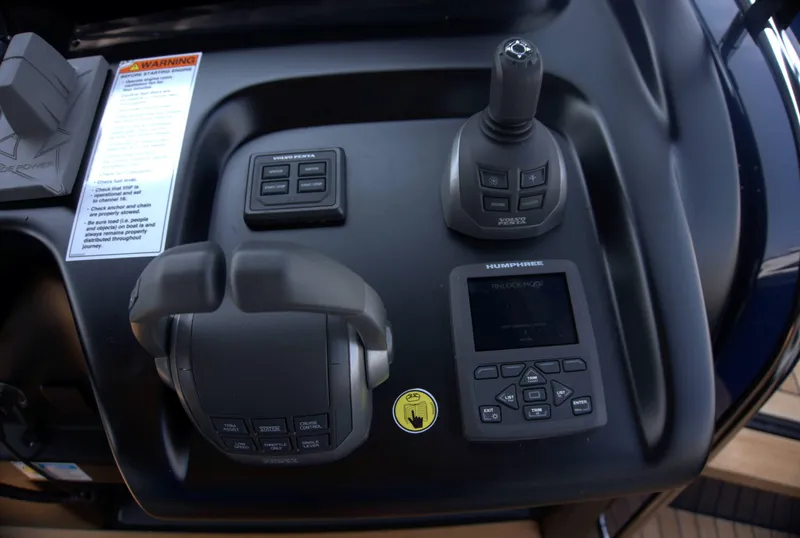 Slide: The Image of Control panel of 2024 Cranchi A46 yacht with joystick and display. - 19