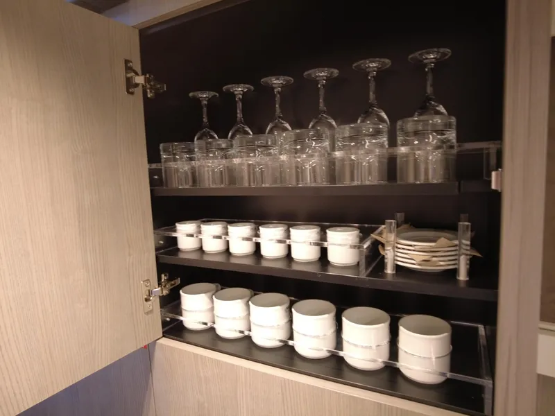 Slide: The Image of Cabinet in Cranchi A46 yacht with glassware and white dishes, 2023 model. - 39