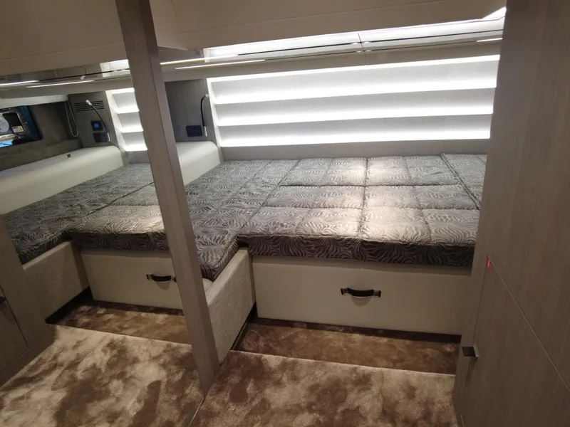 Slide: The Image of 2023 Cranchi A46 interior cabin with twin beds and modern decor. - 41