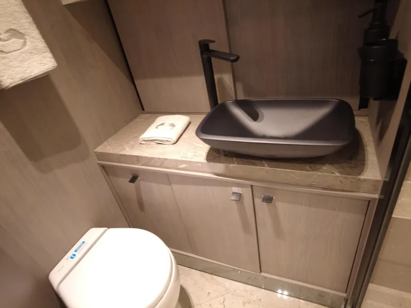 Slide: The Image of Luxurious bathroom in 2024 Cranchi A46 yacht with modern sink and toilet. - 45