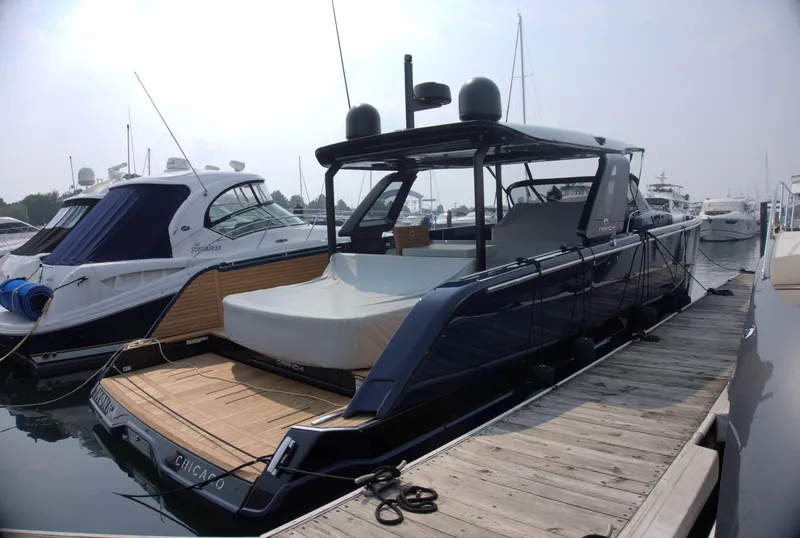 Slide: The Image of 2024 Cranchi A46 yacht docked at marina, showcasing sleek design and modern features. - 5