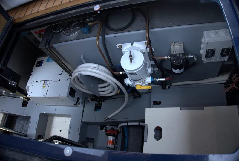 Slide: The Image of Engine compartment of 2024 Cranchi A46 yacht, showcasing mechanical components and wiring. - 57