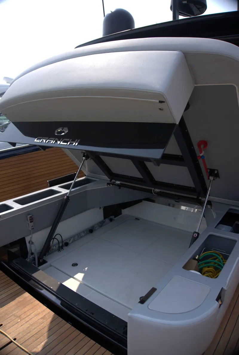 Slide: The Image of 2024 Cranchi A46 yacht with open storage compartment, showcasing sleek design and functionality. - 58