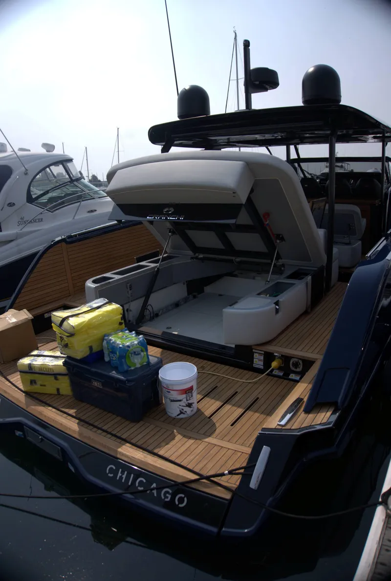 Slide: The Image of 2024 Cranchi A46 yacht with open storage, docked in Chicago marina. - 59
