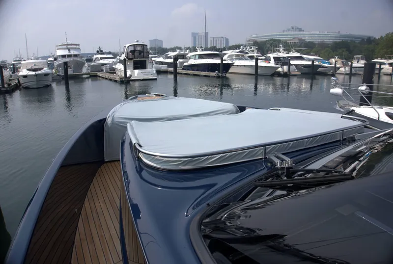 Slide: The Image of 2024 Cranchi A46 yacht docked in a marina, surrounded by other luxury boats. - 9