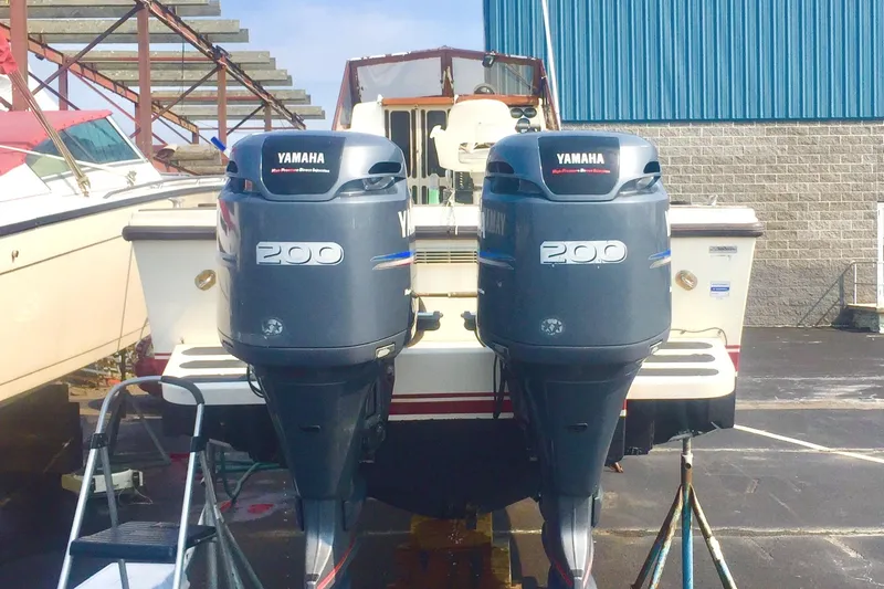 Slide: The Image of 1991 Mako 260 Walk Around with twin Yamaha 200 outboard engines. - 4
