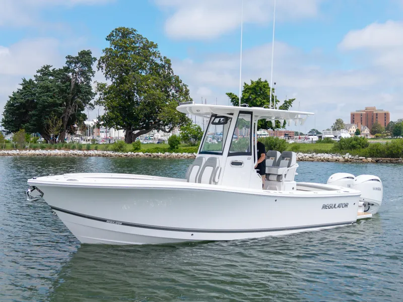 The Image of 2025 Regulator 23 boat on calm water, featuring sleek design and modern amenities. - 0