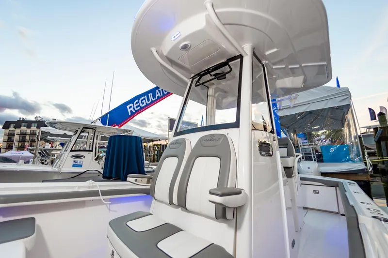 Slide: The Image of 2025 Regulator 23 boat at marina, showcasing sleek design and modern features. - 37