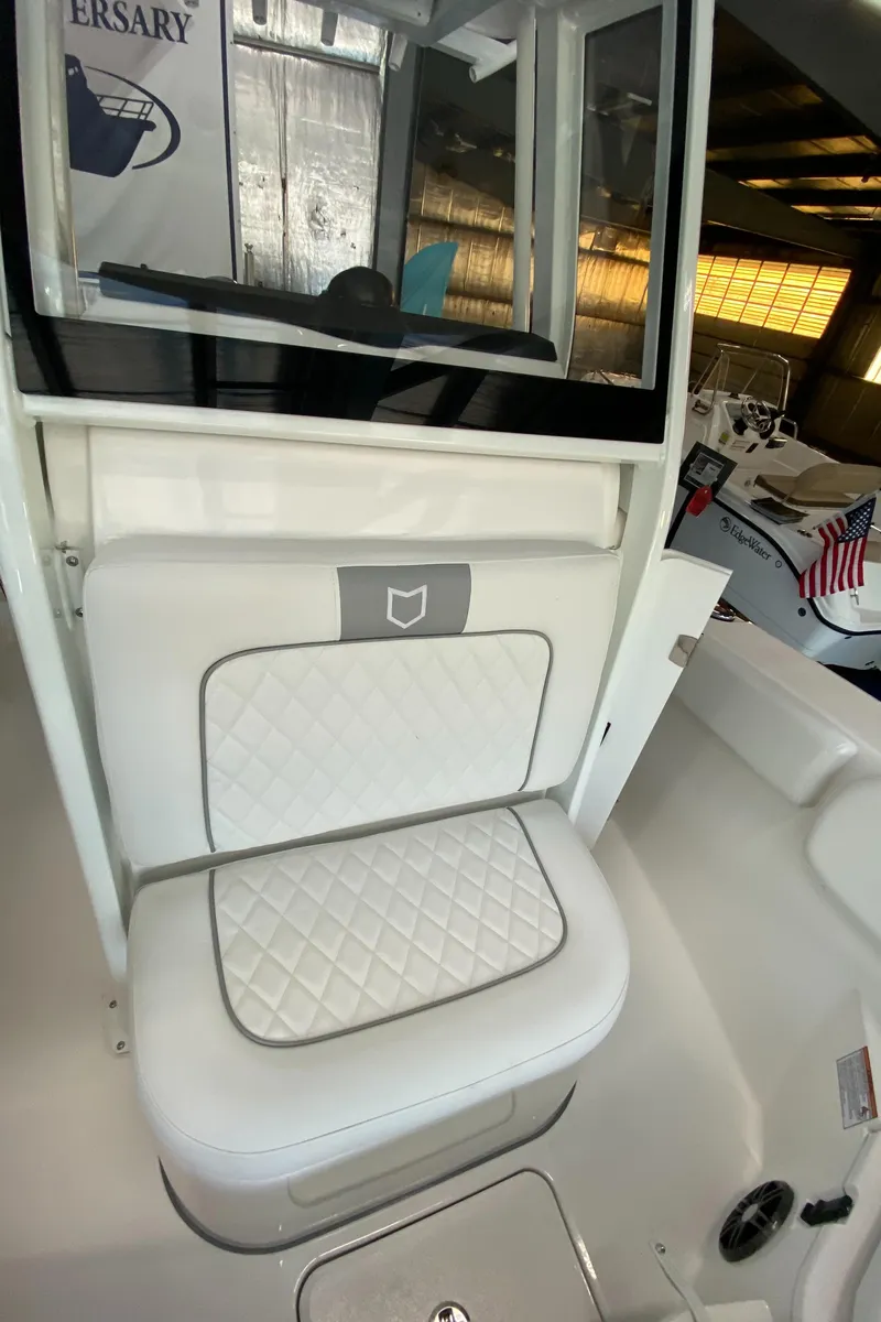 Slide: The Image of 2025 Sea Fox 228 Commander boat interior with cushioned seating. - 13