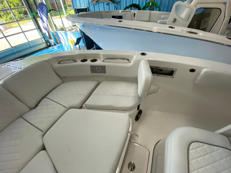 Slide: The Image of 2025 Sea Fox 228 Commander boat interior with white cushioned seating. - 14