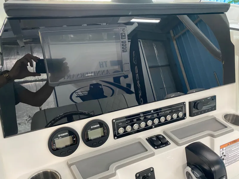 Slide: The Image of 2025 Sea Fox 228 Commander dashboard with navigation and control instruments. - 15