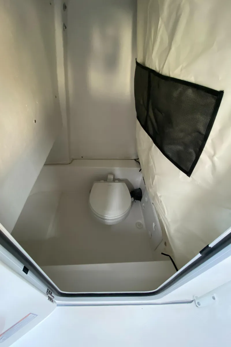 Slide: The Image of 2025 Sea Fox 228 Commander boat interior with compact marine toilet. - 19