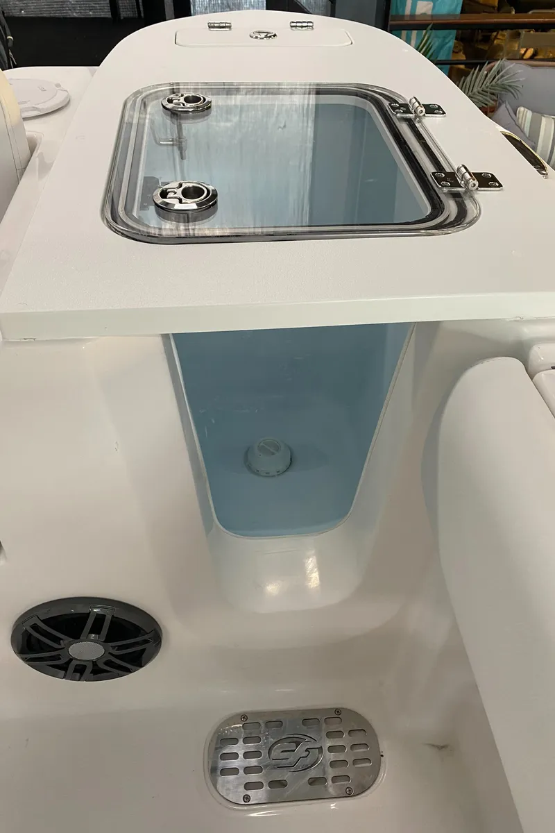Slide: The Image of 2025 Sea Fox 228 Commander livewell with stainless steel latches and drain. - 20