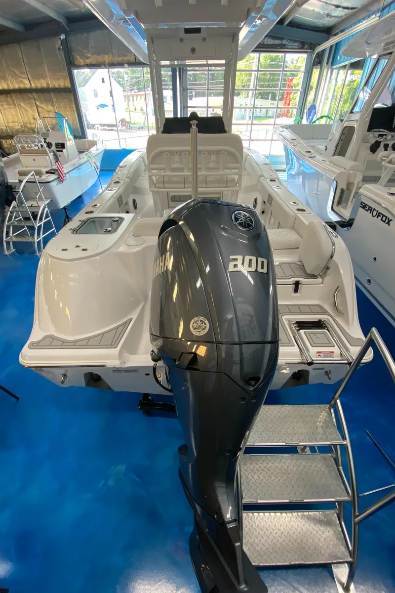 Slide: The Image of 2025 Sea Fox 228 Commander boat with Yamaha 200 engine in showroom. - 25