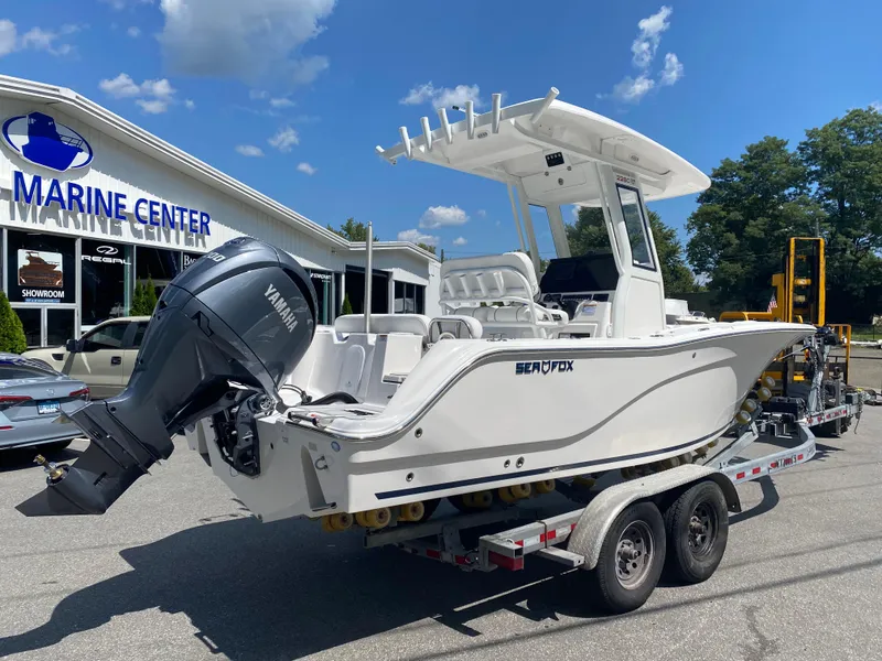Slide: The Image of 2025 Sea Fox 228 Commander boat on trailer at marine center. - 4