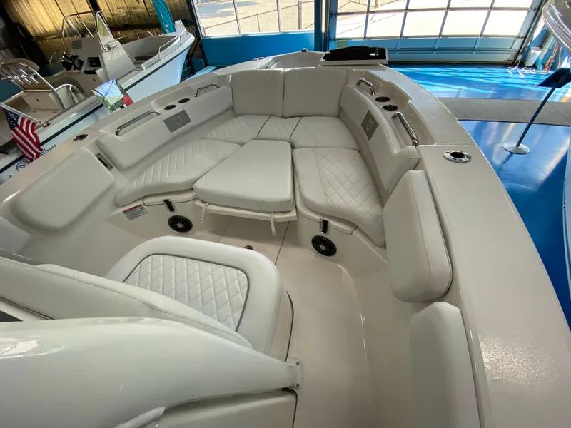 Slide: The Image of 2025 Sea Fox 228 Commander boat interior with cushioned seating in a showroom. - 8