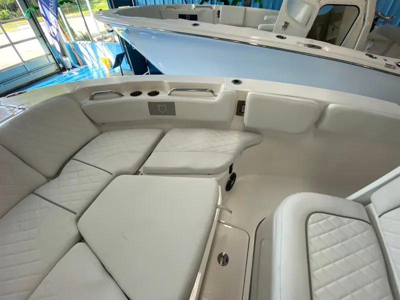 Slide: The Image of 2025 Sea Fox 228 Commander boat interior with white cushioned seating. - 9