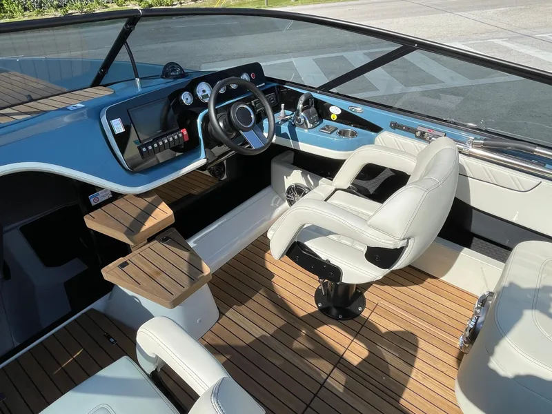 Slide: The Image of Interior of 2022 Cranchi 26 Classic boat with modern dashboard and leather seats. - 22