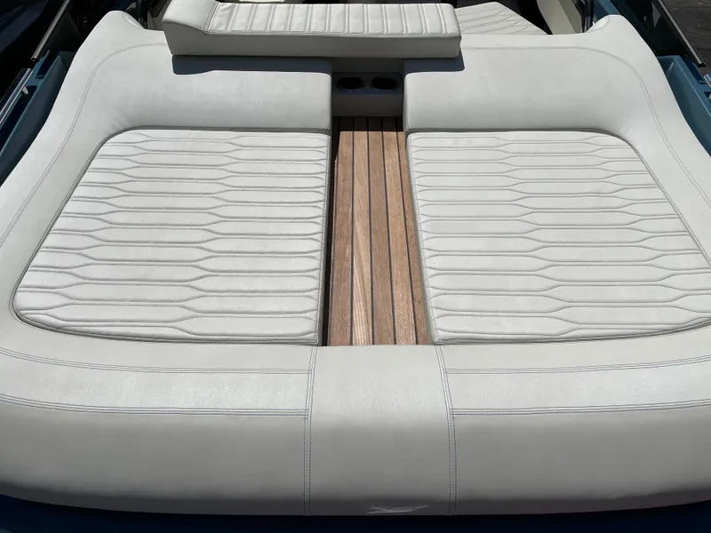 Slide: The Image of 2022 Cranchi 26 Classic boat with cushioned sun deck and wooden flooring. - 25