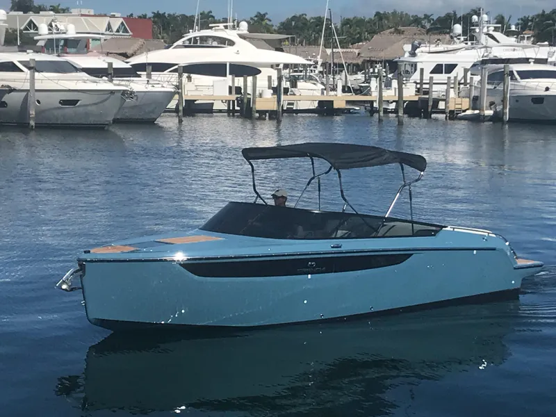 Slide: The Image of 2022 Cranchi 26 Classic boat docked in a marina with other yachts. - 7