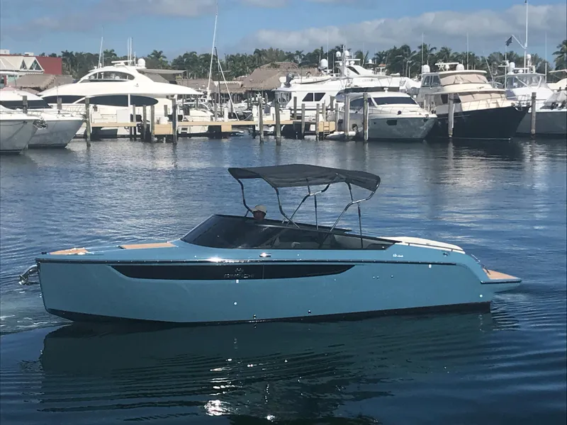 Slide: The Image of 2022 Cranchi 26 Classic boat docked in a marina with other yachts. - 8