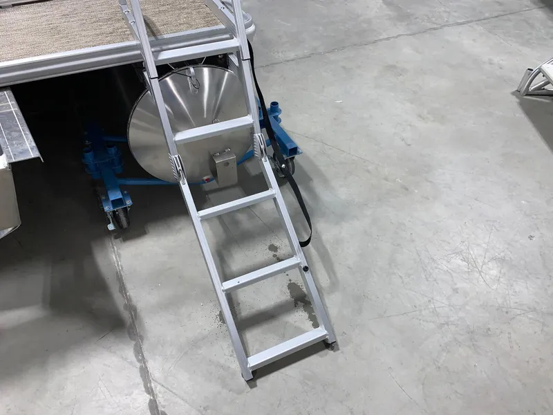 Slide: The Image of 2024 Starcraft LX22 F boat ladder and fuel tank on concrete floor. - 11