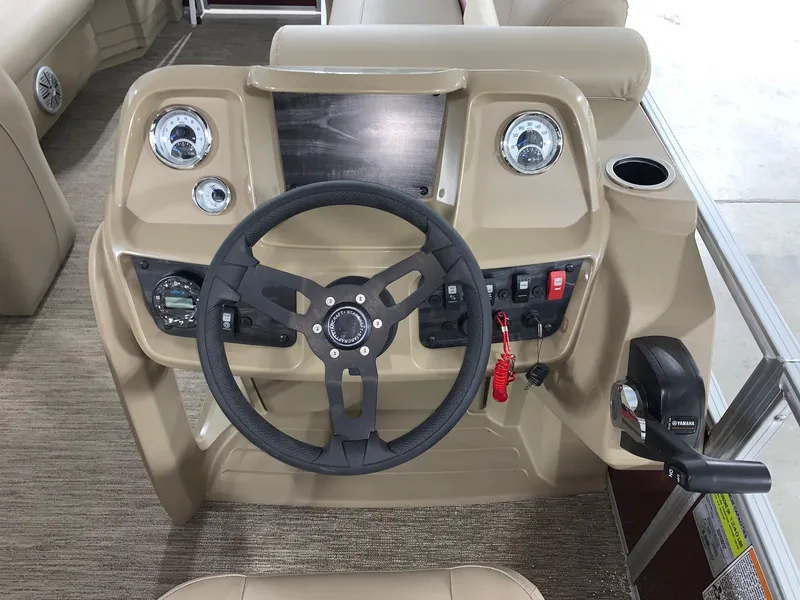 Slide: The Image of 2024 Starcraft LX22 F boat dashboard with steering wheel and control panel. - 6