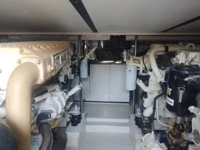 Slide: The Image of Engine room of 2003 Riviera 48 Conv yacht, showcasing mechanical components and systems. - 31