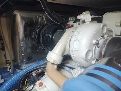 Slide: The Image of Engine compartment of a 2003 Riviera 48 Convertible boat, showcasing mechanical components. - 32