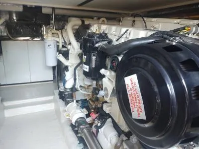 Slide: The Image of Engine room of 2003 Riviera 48 Conv yacht, showcasing mechanical components and systems. - 35