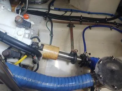 Slide: The Image of Engine room of 2003 Riviera 48 conv with visible mechanical components and blue hoses. - 37