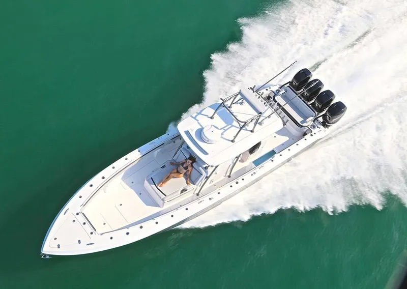 Slide: The Image of 2023 Nor-Tech 392 Super Fish boat cruising on open water. - 2