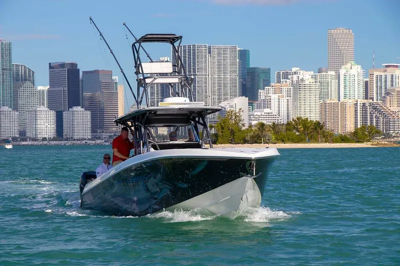 Slide: The Image of 2023 Nor-Tech 392 Super Fish boat cruising near city skyline. - 5