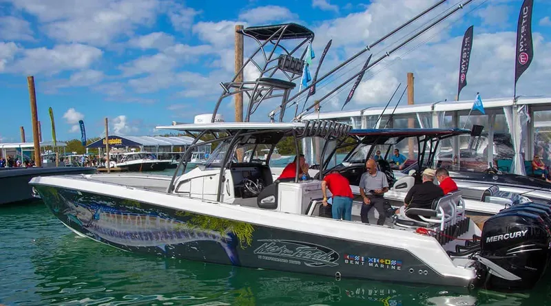 Slide: The Image of 2023 Nor-Tech 392 Super Fish boat docked at a marina with people onboard. - 6