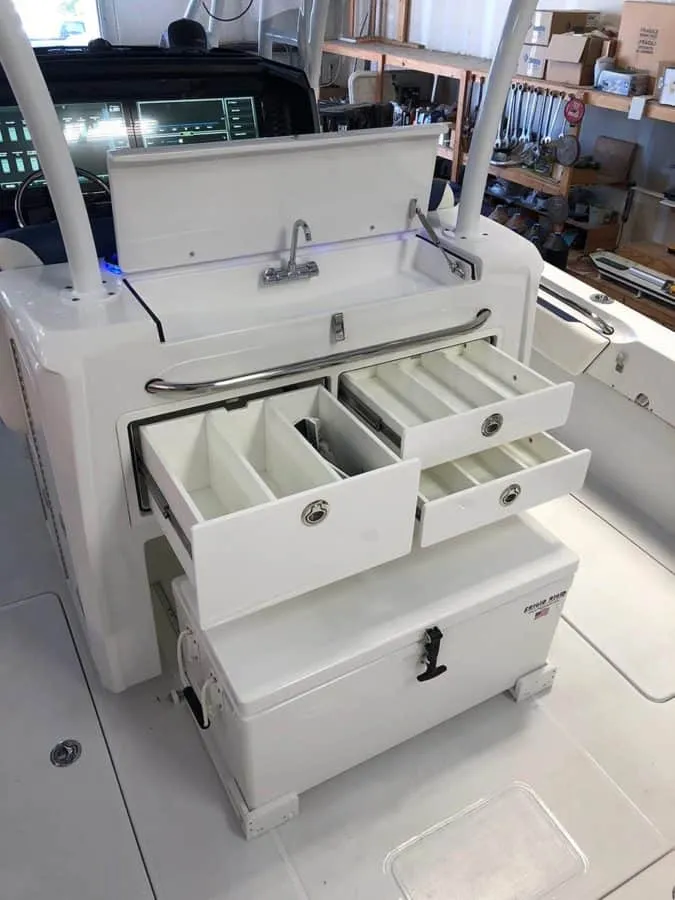 Slide: The Image of 2023 Nor-Tech 392 Super Fish boat with open storage drawers and compartments. - 8
